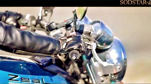 Gloved hand gripping motorcycle handlebars in blue bike close-up, erotic JAV scene