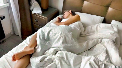 Eva Elfie petite blonde lying nude in bed, seductive rest pose
