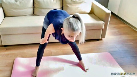 Skinny blonde in tight yoga pants bends over in ass-up solo yoga pose teasing cameltoe