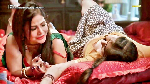 Two Indian MILF lesbians in intimate clothed bed tease