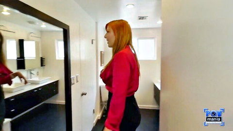 Lauren Phillips redhead MILF posing in red blouse and black pants POV