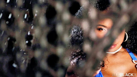 Amari Anne peeking seductively through fence in blue top