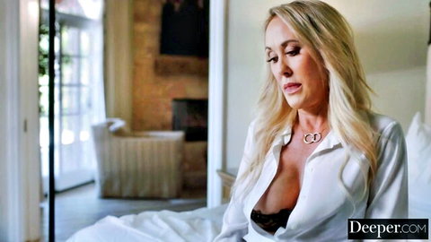 Kendra Sunderland blonde bombshell in open white shirt revealing black lace bra cleavage