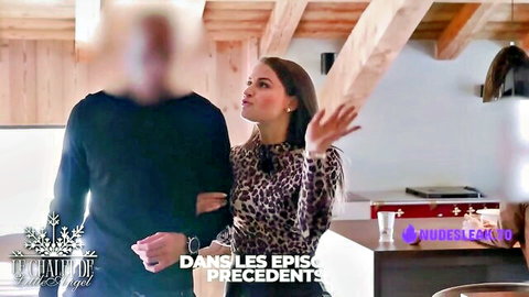 Little Angel in leopard print top gesturing with man in intimate chalet moment