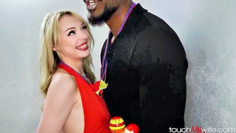 Smiling blonde wife in revealing red dress with medium tits poses close to BBC black bull with beads necklace