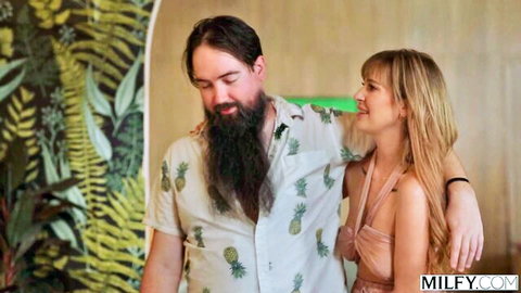 Blonde big tits MILF in skimpy dress hugs bearded man in Hawaiian shirt