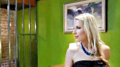 Tara Ashley blonde beauty in strapless black dress, seductive side profile
