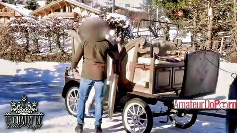 LittleAngel in snowy chalet loading vintage cart, winter outdoor tease