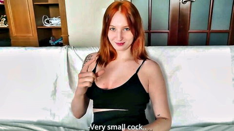 Redhead stepsister in revealing black tank top, smirking teasingly