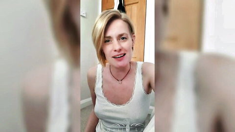 Blonde amateur solo girl smiling in lace white tank top webcam