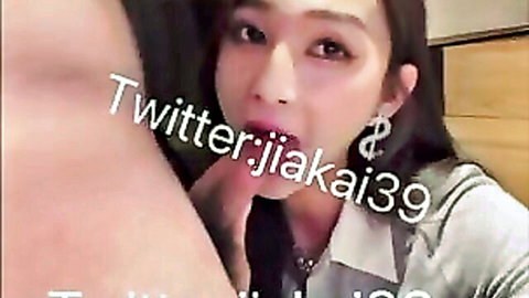 Chinese beauty giving intense blowjob close-up in white shirt