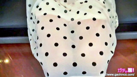 Asian woman in sheer white polka dot dress revealing ass from behind