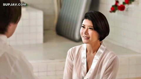 Yuuri Oshikawa in white silk robe, smiling in intimate bath chat