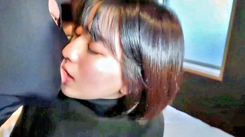 Intimate close-up of Japanese actress in black turtleneck during passionate embrace