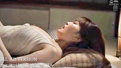 Seductive Asian woman in low-cut beige dress lying on bed, aroused expression, JAV incest scene
