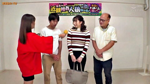 Japanese women in red jacket and striped sweater chatting with young and older men holding mic on TV show