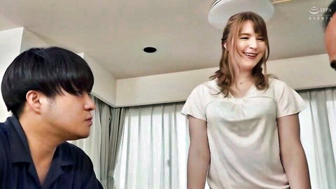 Freckled young blonde housewife smiling seductively at two horny Asian men in living room