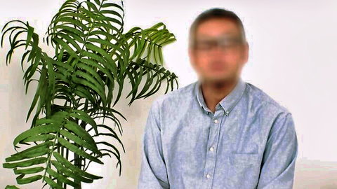 Blurry Asian man in blue shirt posing for wife photographer, amateur solo