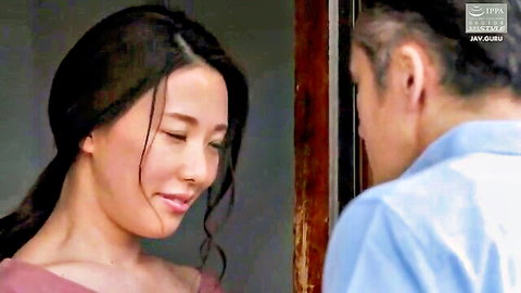 Intimate close-up of Japanese mother and son gazing at each other