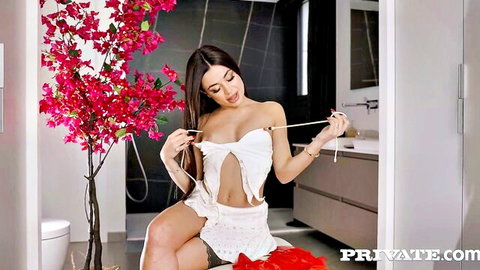 Martina Smeraldi in torn white lingerie teasing busty pose