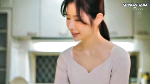 Japanese mature milf in low-cut pink dress showing deep cleavage in kitchen