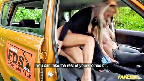 Blonde babe strips in car during driving lesson oral sex tease