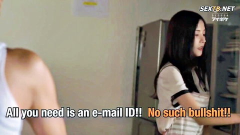Kaede in casual white top teasing shirtless man in JAV kitchen scene