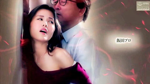 Asian beauty in red dress pinned against wall by older man in steamy embrace