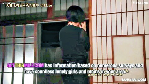 Busty Japanese MILF in tight black dress stands teasing in bedroom doorway