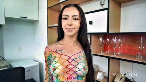 Giih Spanic in sexy rainbow fishnet top exposing bare breasts