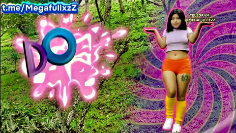 Dora La Folladora posing sexy in crop top and orange shorts outdoors