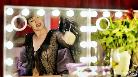 Daisy Taylor in sheer black lingerie posing seductively in mirror