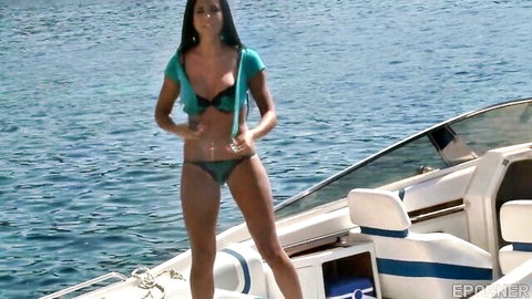 Stunning brunette teen in teal bikini on yacht, erotic solo pose by water