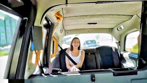 Smiling brunette jogger in tight white tank top in Fake Taxi backseat