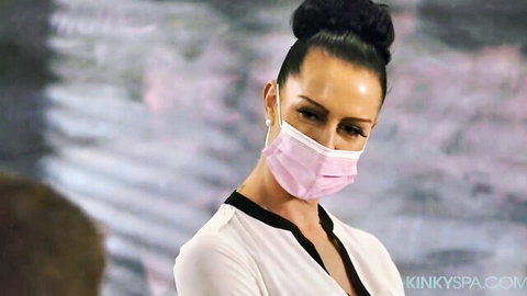 Seductive brunette babe in pink face mask and white blouse teasing seductively