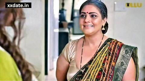 Indian desi mature stepmother in colorful saree smiling at young woman