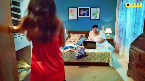 Priya Mishra in red dress entering bedroom for romance with man on bed