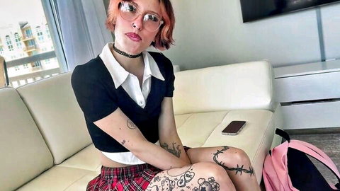 Elle Marz in sexy schoolgirl outfit with tattoos and orange hair