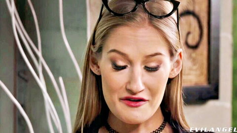 Tiffany Tatum in glasses and choker, seductive pout from Rocco scene