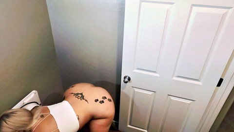 Blonde Dani bent over showing tattooed big ass in white crop top