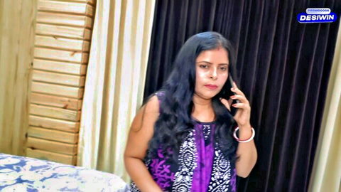 Beautiful Indian girl in purple dress talking on phone, amateur style