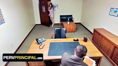 Brunette in pink dress enters principal's office eyeing suited man at desk