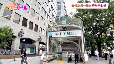 Roppongi subway entrance with Japanese commuters in urban street scene