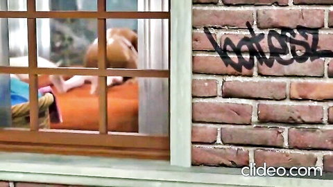 Mother Morales MILF relaxes by window with dog, casual home scene