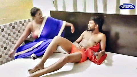 Desi Indian girl with big boobs exposed in blue sari, hardcore tease with man in red shorts