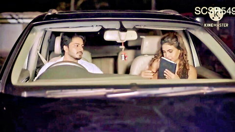 Indian babe with big tits reading book in car next to handsome guy