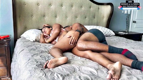 Tattooed Latina with big bare ass spooned intimately by guy in underwear on bed