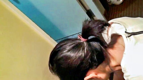 POV closeup of sexy East Asian babe with ponytail in white top from behind