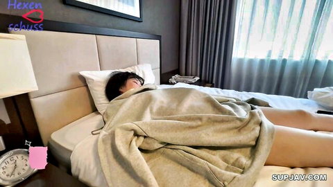 Asian woman resting under blanket in bed, uncensored JAV tease