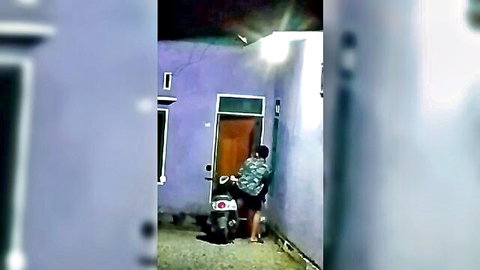Amateur Asian man peeking at neighbor's house at night, voyeur style